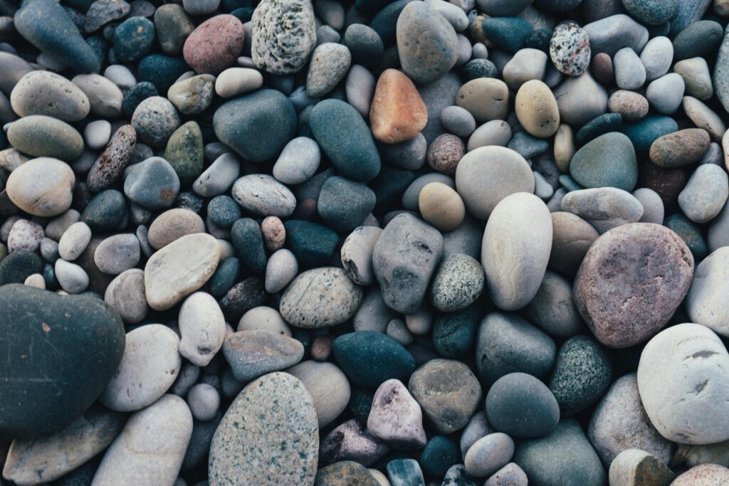 pexels photo 1029604 1029604 A detailed view of smooth, multicolored pebbles creating a natural texture and pattern.